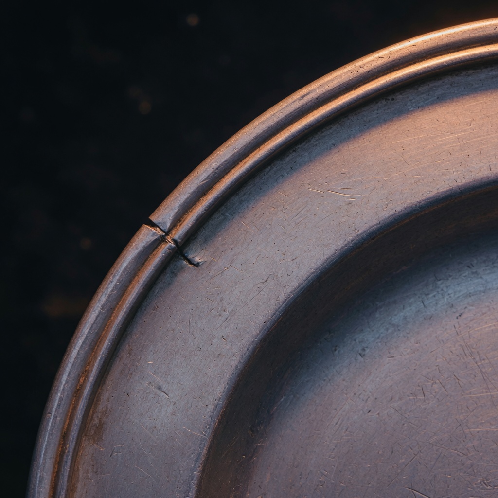 John Kirton — pewter still, steward interpretation, not a historical likeness